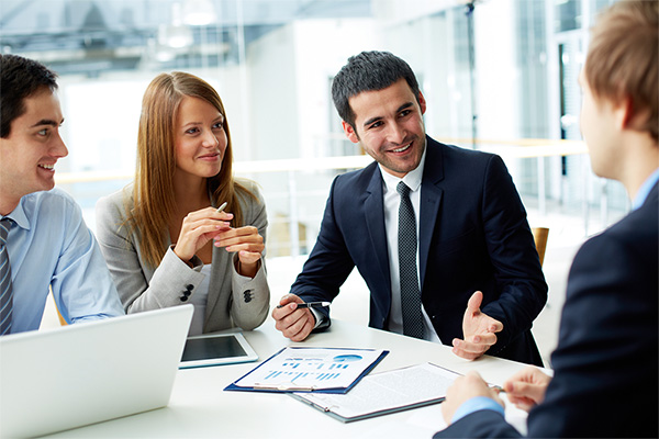 Employees discussing at work